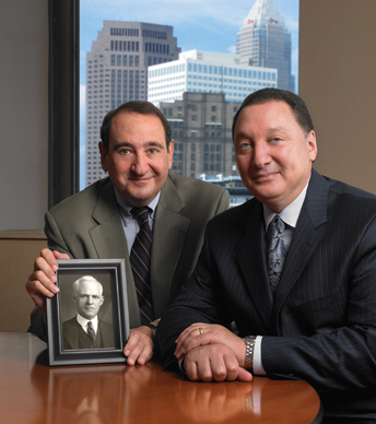 Photo of Board Chairman David Goldberg and President & CEO Ronald Richard holding a picture of Frederick Harris Goff