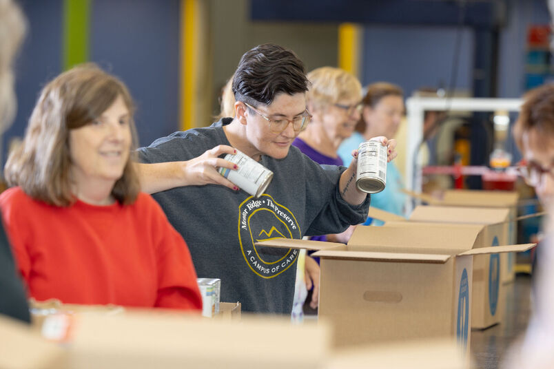 Photo of Food Bank volunteers packing boxes